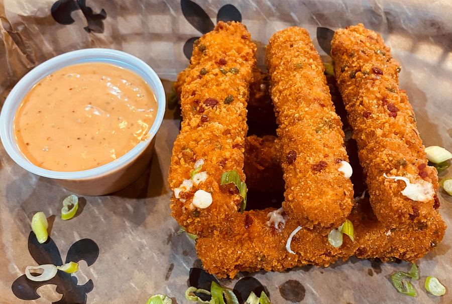 Breaded cajun jalapeño cheese sticks with dipping sauce
